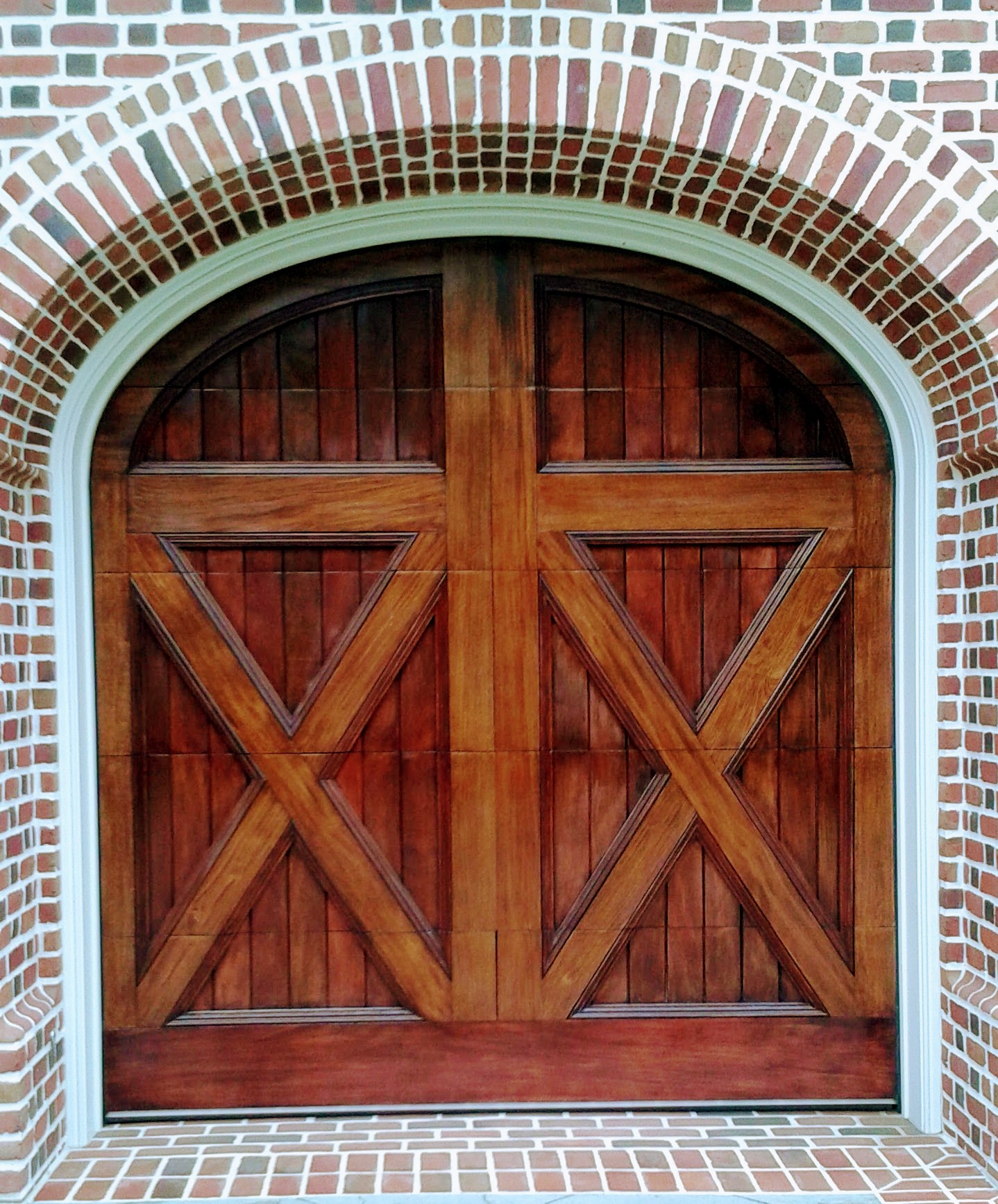 Custom arched X-brace mahogany garage door